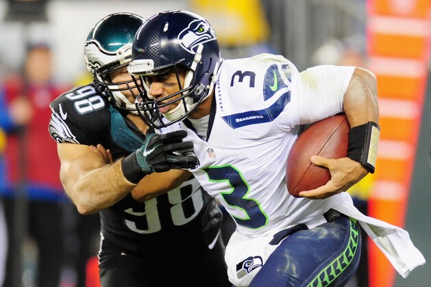 PHILADELPHIA, PA - DECEMBER 07:  Russell Wilson #3 of the Seattle Seahawks runs the ball against  Connor Barwin #98 of the Philadelphia Eagles during the first half of the game at Lincoln Financial Field on December 7, 2014 in Philadelphia, Pennsylvania.  (Photo by Evan Habeeb/Getty Images)