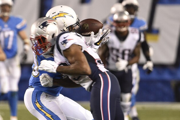 San Diego Chargers tight end Ladarius Green is hit by New England Patriots cornerback Brandon Browner during the second half in an NFL football game Sunday, Dec. 7, 2014, in San Diego. (AP Photo/Denis Poroy)