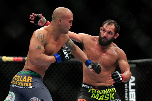LAS VEGAS, NV - DECEMBER 06:  Robbie Lawler punches Johny Hendricks in their welterweight title fight during the UFC 181 event at the Mandalay Bay Events Center on December 6, 2014 in Las Vegas, Nevada.  (Photo by Alex Trautwig/Getty Images)