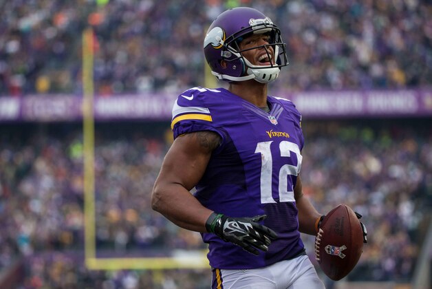 Nov 23, 2014; Minneapolis, MN, USA; Minnesota Vikings wide receiver Charles Johnson (12) celebrates a two-point conversion during the fourth quarter against the Green Bay Packers at TCF Bank Stadium. The Packers defeated the Vikings 24-21. Mandatory Credit: Brace Hemmelgarn-USA TODAY Sports