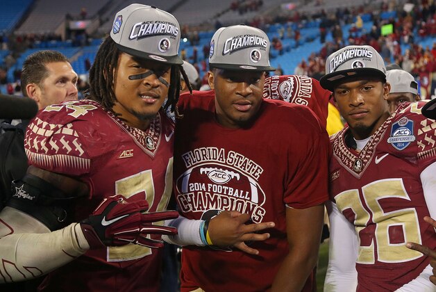 CHARLOTTE, NC - DECEMBER 06:  Matthew McNulty #24 , Jameis Winston #5 and P.J. Williams congratulate each other after their 37-35 victory over the Georgia Tech Yellow Jackets at the ACC Championship game on December 6, 2014 in Charlotte, North Carolina.  (Photo by Mike Ehrmann/Getty Images)