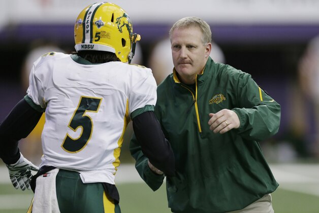 North Dakota State head coach Chris Klieman talks with wide receiver Colter Pritchard, left, before an NCAA college football game against Northern Iowa, Saturday, Nov. 8, 2014, in Cedar Falls, Iowa. (AP Photo/Charlie Neibergall)