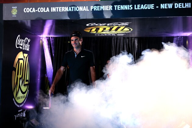 DELHI, INDIA - DECEMBER 07:  Roger Federer of the Indian Aces makes his IPTL debut for his team in their match against the Singapore Slammers during the Coca-Cola International Premier Tennis League third leg at the Indira Gandhi Indoor Stadium December 7, 2014 in Delhi, Delhi.  (Photo by Clive Brunskill/Getty Images for IPTL 2014)