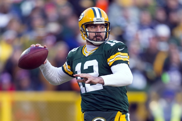 Nov 30, 2014; Green Bay, WI, USA; Green Bay Packers quarterback Aaron Rodgers (12) throws a pass during the first quarter against the New England Patriots at Lambeau Field. Mandatory Credit: Jeff Hanisch-USA TODAY Sports