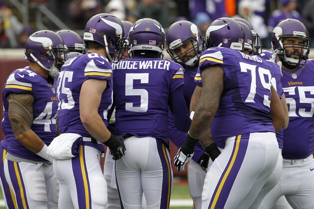 Minnesota Vikings quarterback Teddy Bridgewater, center, huddles with teammates during the first half of an NFL football game against the New York Jets, Sunday, Dec. 7, 2014, in Minneapolis. (AP Photo/Ann Heisenfelt)