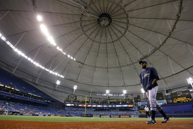Tampa Bay Rays relief pitcher Josh Lueke walks to the dugout after some of the power went out at Tropicana Field during the eighth inning of a baseball game against the Baltimore Orioles, Tuesday, May 6, 2014, in St. Petersburg, Fla. (AP Photo/Chris O'Meara)