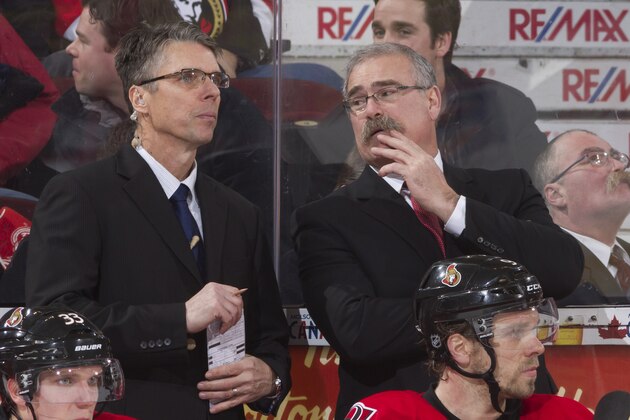 OTTAWA, CANADA - JANUARY 21: Assistant coach Dave Cameron (L) chats with head coach Paul MacLean (M) of the Ottawa Senators as a doppleganger of the coach Mike Watson (R) looks on during an NHL game against the Florida Panthers at Scotiabank Place on January 21, 2013 in Ottawa, Ontario, Canada.  (Photo by Jana Chytilova/Freestyle Photography/Getty Images)