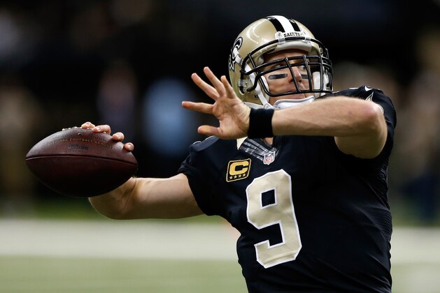 NEW ORLEANS, LA - DECEMBER 07:  Drew Brees #9 of the New Orleans Saints warms up before the game against the Carolina Panthers at Mercedes-Benz Superdome on December 7, 2014 in New Orleans, Louisiana.  (Photo by Sean Gardner/Getty Images)