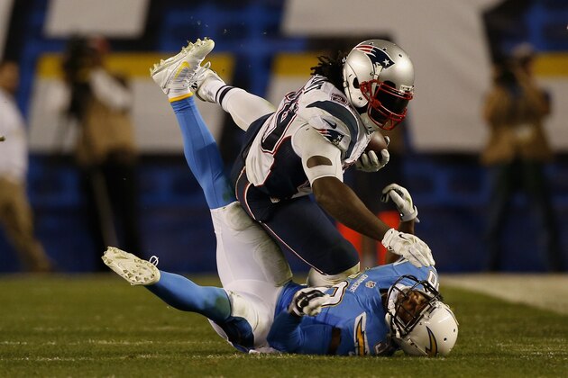 SAN DIEGO, CA - DECEMBER 07:  Running back LeGarrette Blount #29 of the New England Patriots is tackled by strong safety Marcus Gilchrist #38 of the San Diego Chargers at Qualcomm Stadium on December 7, 2014 in San Diego, California.  (Photo by Todd Warshaw/Getty Images)