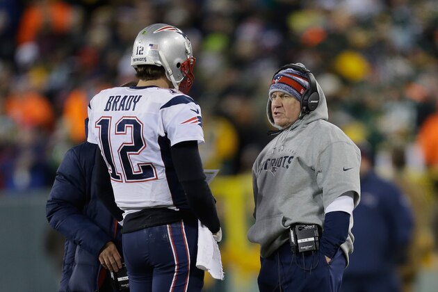 GREEN BAY, WI - NOVEMBER 30:  Quarterback Tom Brady #12 of the New England Patriots talks with head coach Bill Belichick in the second quarter during the NFL game against the Green Bay Packers at Lambeau Field on November 30, 2014 in Green Bay, Wisconsin.  (Photo by Mike McGinnis/Getty Images)