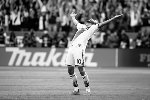 LOS ANGELES, CA - DECEMBER 07:  (EDITOR'S NOTE: Image has been converted to black and white.) Landon Donovan #10 of the Los Angeles Galaxy reacts after the Galaxy defeated the New England Revolution 2-1 in the 2014 MLS Cup at StubHub Center on December 7, 2014 in Los Angeles, California.  (Photo by Victor Decolongon/Getty Images)