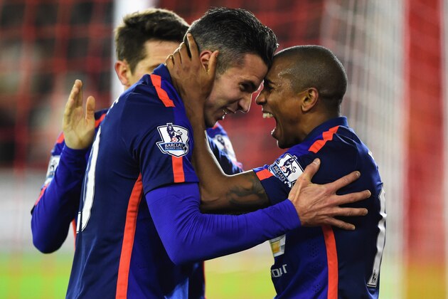 SOUTHAMPTON, ENGLAND - DECEMBER 08:  Robin van Persie of Manchester United celebrates scoring his second goal with Ashley Young of Manchester United during the Barclays Premier League match between Southampton and Manchester United at St Mary's Stadium on December 8, 2014 in Southampton, England.  (Photo by Mike Hewitt/Getty Images)