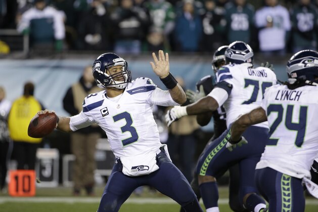 Seattle Seahawks' Russell Wilson passes during the second half of an NFL football game against the Philadelphia Eagles, Sunday, Dec. 7, 2014, in Philadelphia. (AP Photo/Matt Rourke)