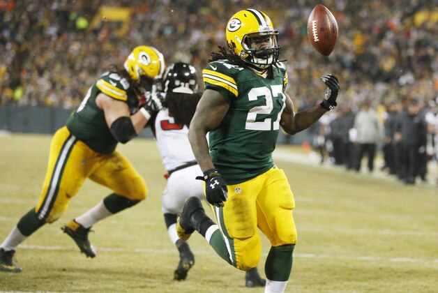 Green Bay Packers' Eddie Lacy celebrates his touchdown run during the first half of an NFL football game against the Atlanta Falcons Monday, Dec. 8, 2014, in Green Bay, Wis. (AP Photo/Tom Lynn)