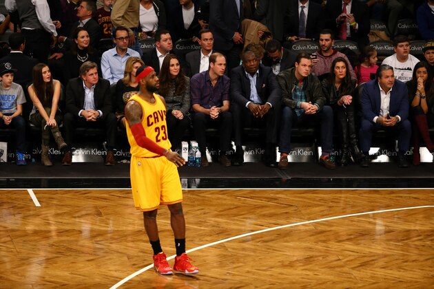 NEW YORK, NY - DECEMBER 08:  Prince William, Duke of Cambridge and Catherine, Duchess of Cambridge watch as LeBron James #23 of the Cleveland Cavaliers looks on during his game against the Brooklyn Nets at Barclays Center on December 8, 2014 in the Brooklyn borough of New York City.  NOTE TO USER: User expressly acknowledges and agrees that, by downloading and or using this photograph, User is consenting to the terms and conditions of the Getty Images License Agreement.  (Photo by Al Bello/Getty Images)