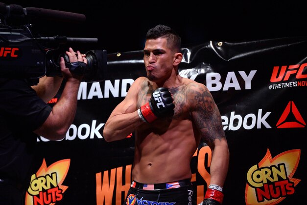 Dec 6, 2014; Las Vegas, NV, USA; Anthony Pettis (red) and Gilbert Melendez (blue) during UFC 181 at Madalay Bay Events Center. Pettis won via second round submission. Mandatory Credit: Joe Camporeale-USA TODAY Sports