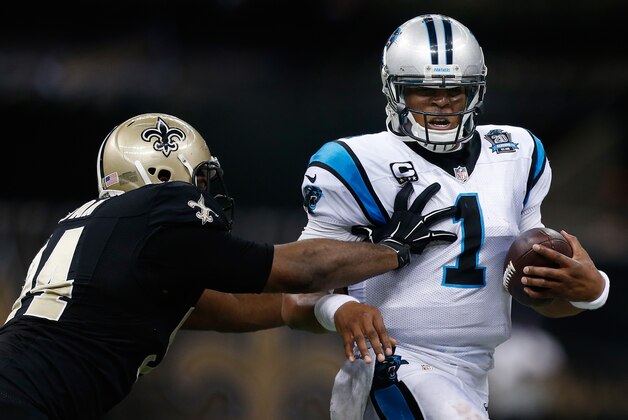 NEW ORLEANS, LA - DECEMBER 07:   Cam Newton #1 of the Carolina Panthers runs the ball as  Cameron Jordan #94 of the New Orleans Saints defends during the second quarter at Mercedes-Benz Superdome on December 7, 2014 in New Orleans, Louisiana.  (Photo by Sean Gardner/Getty Images)