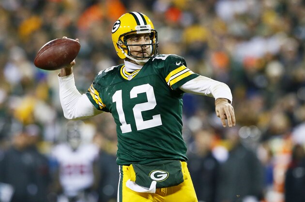 GREEN BAY, WI - DECEMBER 08:   Aaron Rodgers #12 of the Green Bay Packers looks to pass in the third quarter against the Atlanta Falcons at Lambeau Field on December 8, 2014 in Green Bay, Wisconsin.  (Photo by Kevin C. Cox/Getty Images)