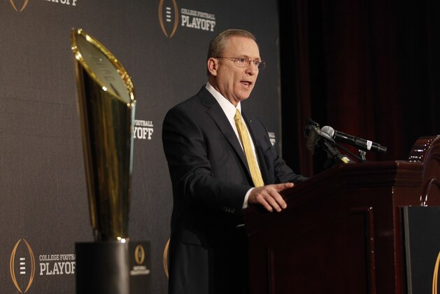 Jeff Long, College Football Playoff selections committee chairman, discusses the selection process of the semifinal pairings and semifinal bowl assignments during a news conference Sunday, Dec. 7, 2014, in Grapevine, Texas.   (AP Photo/Tim Sharp)