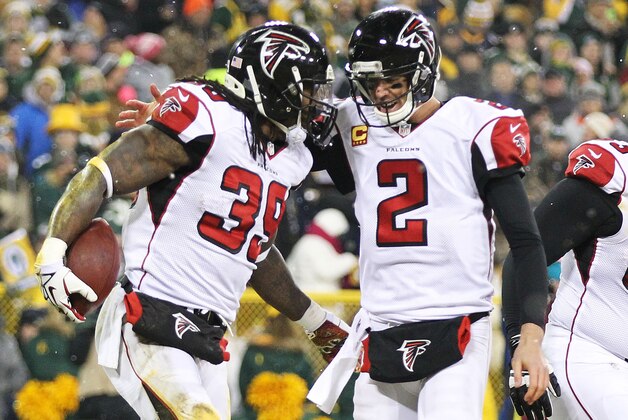 GREEN BAY, WI - DECEMBER 08:   Matt Ryan #2 and  Steven Jackson #39 of the Atlanta Falcons celebrate a touchdown in the first quarter against the Green Bay Packers at Lambeau Field on December 8, 2014 in Green Bay, Wisconsin.  (Photo by Mike McGinnis/Getty Images)