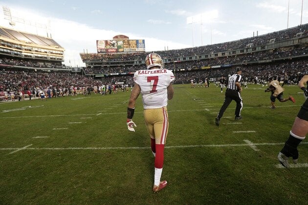 San Francisco 49ers quarterback Colin Kaepernick (7) walks off the field during the second half of an NFL football game against the Oakland Raiders in Oakland, Calif., Sunday, Dec. 7, 2014. (AP Photo/Marcio Jose Sanchez)