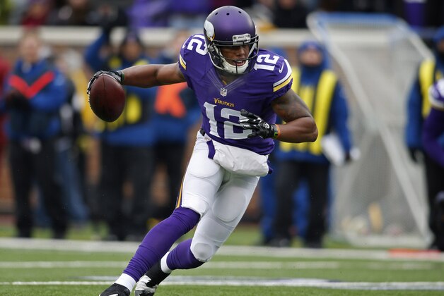 Dec 7, 2014; Minneapolis, MN, USA; Minnesota Vikings wide receiver Charles Johnson (12) catches a pass against the New York Jets but fumbles it at the goal line before the Vikings recover it for a touchdown in the second quarter at TCF Bank Stadium. Mandatory Credit: Bruce Kluckhohn-USA TODAY Sports