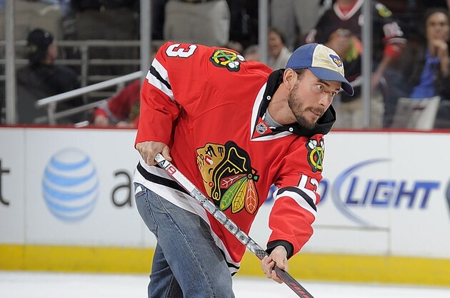 CHICAGO, IL - MARCH 21:  WWE Champion CM Punk shoots the puck in between periods during the NHL game between the Vancouver Canucks and the Chicago Blackhawks on March 21, 2012 at the United Center in Chicago, Illinois. (Photo by Bill Smith/NHLI via Getty Images)