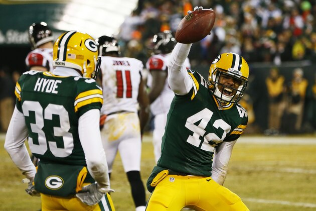 GREEN BAY, WI - DECEMBER 08:  Morgan Burnett #42 celebrates his interception with  Micah Hyde #33 of the Green Bay Packers in the second quarter against the Atlanta Falcons at Lambeau Field on December 8, 2014 in Green Bay, Wisconsin.  (Photo by Kevin C. Cox/Getty Images)