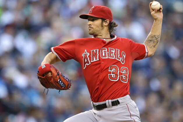 Los Angeles Angels starting pitcher C.J. Wilson throws against the Seattle Mariners in the first inning of a baseball game, Saturday, Sept. 27, 2014, in Seattle. (AP Photo/Ted S. Warren)
