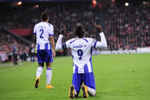 FC Porto's Jackson Martinez, right, celebrates after scoring his goal against Athletic Bilbao, during the Champions League Group H soccer match between Athletic Bilbao and FC Porto, at San Mames stadium, in Bilbao, northern Spain, Wednesday, Nov. 5, 2014. (AP Photo/Alvaro Barrientos)