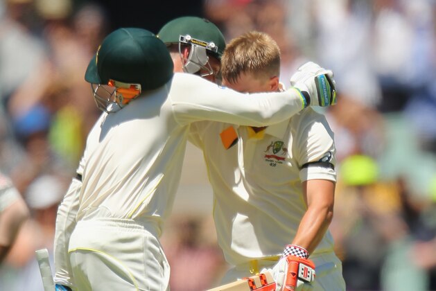 ADELAIDE, AUSTRALIA - DECEMBER 09:  David Warner of Australia is congratulated by Michael Clarke as he reaches his century during day one of the First Test match between Australia and India at Adelaide Oval on December 9, 2014 in Adelaide, Australia.  (Photo by Scott Barbour/Getty Images)