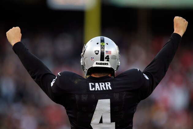 OAKLAND, CA - DECEMBER 07:  Derek Carr #4 of the Oakland Raiders celebrates in the fourth quarter against the San Francisco 49ers at O.co Coliseum on December 7, 2014 in Oakland, California.  (Photo by Brian Bahr/Getty Images)