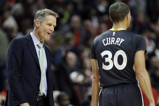 Golden State Warriors head coach Steve Kerr talks with guard Stephen Curry (30) during the second half of an NBA basketball game against the Chicago Bulls in Chicago on Saturday, Dec. 6, 2014. The Warriors won 112-102. (AP Photo/Nam Y. Huh)