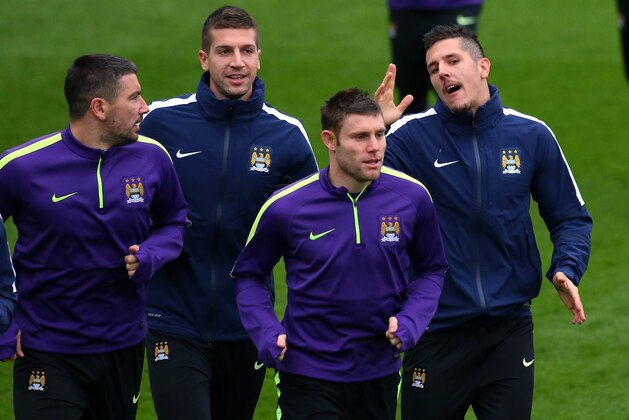 MANCHESTER, ENGLAND - DECEMBER 09:  Aleksandar Kolarov, Stevan Jovetic,James Milner and Matija Nastasic of Manchester City warm up during a training session at the City Football Academy on December 9, 2014 in Manchester, England.  (Photo by Alex Livesey/Getty Images)