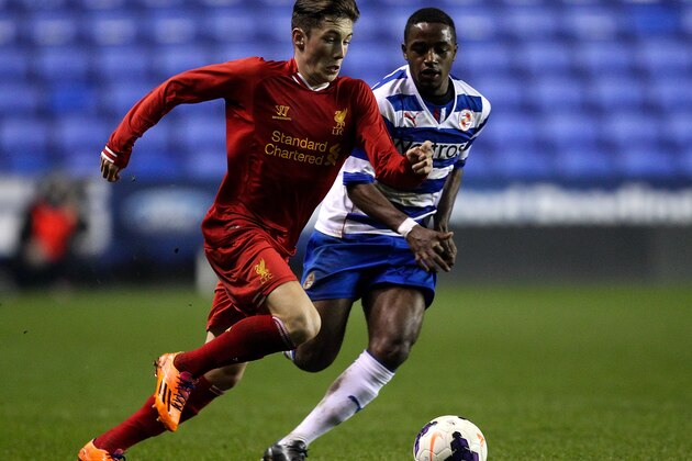 READING, ENGLAND - MARCH 12: Harry Wilson of Liverpool holds off pressure from Tarique Fosu of Reading during the FA Youth Cup 6th Round match between Reading U18 and Liverpool U18 at Madejski Stadium on March 12, 2014 in Reading, England.  (Photo by Ben Hoskins/Getty Images)