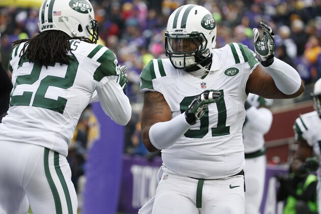 New York Jets defensive end Sheldon Richardson, right, celebrates with teammate Marcus Williams after sacking Minnesota Vikings quarterback Teddy Bridgewater for a safety during the first half of an NFL football game, Sunday, Dec. 7, 2014, in Minneapolis. (AP Photo/Alex Brandon)