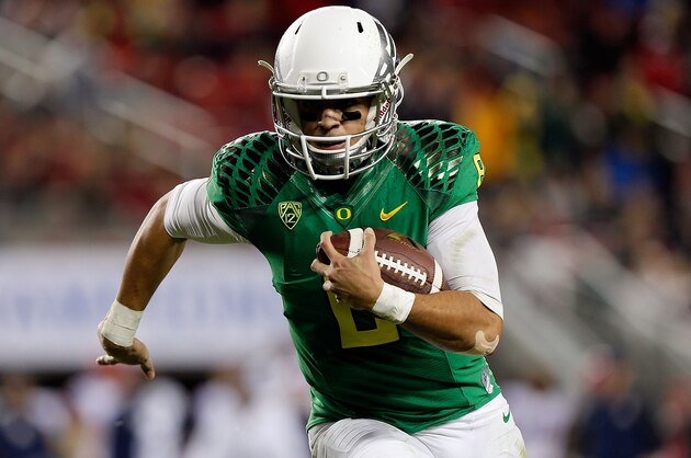 SANTA CLARA, CA - DECEMBER 05: Marcus Mariota #8 of the Oregon Ducks scrambles in the first half against the Arizona Wildcats during the PAC-12 Championships at Levi's Stadium on December 5, 2014 in Santa Clara, California. (Photo by Brian Bahr/Getty Images)