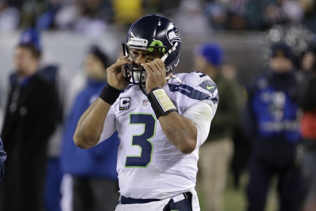 Seattle Seahawks' Russell Wilson stands on the sidelines during the second half of an NFL football game against the Philadelphia Eagles, Sunday, Dec. 7, 2014, in Philadelphia. (AP Photo/Matt Rourke)