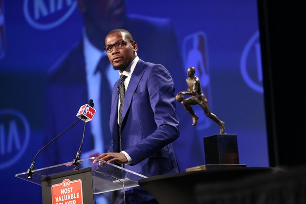 EDMOND, OK - MAY 06:  Kevin Durant of the Oklahoma City Thunder speaks to the media after receiving the Maurice Podoloff Trophy at the 2013-14 KIA Player of the Year award during a press conference on May 6, 2014 at the Thunder Events Center in Edmond, Oklahoma. NOTE TO USER: User expressly acknowledges and agrees that, by downloading and or using this photograph, User is consenting to the terms and conditions of the Getty Images License Agreement. Mandatory Copyright Notice: Copyright 2014 NBAE  (Photo by Layne Murdoch/NBAE via Getty Images)