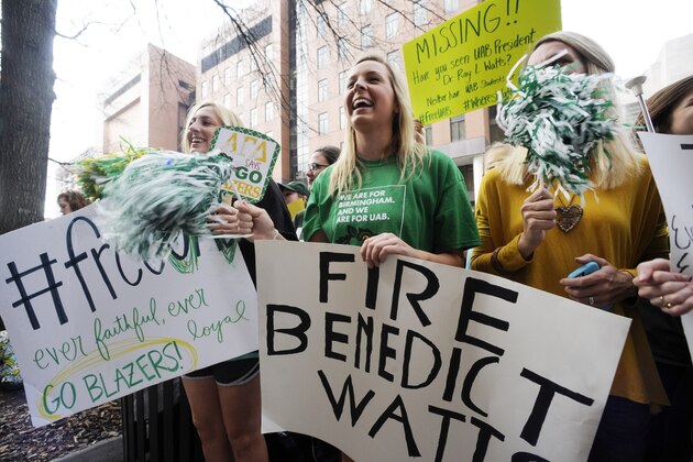 UAB student Mallory Sisk, center, chants with other demonstrators protesting the possible shutdown of the football program at the University of Alabama at Birmingham on Tuesday, Dec. 2, 2014, in Birmingham, Ala. Several hundred students, athletes and fans marched to the administration building on the third straight day of protests on campus. (AP Photo/Jay Reeves)