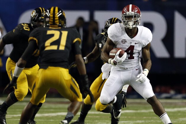 Alabama running back T.J. Yeldon (4) carries the ball against Missouri during the first half of an NCAA college football game Saturday, Dec. 6, 2014, in Atlanta, Ga. (AP Photo/Butch Dill)