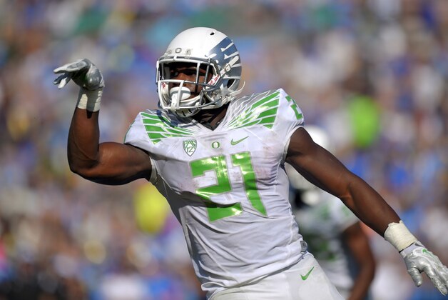 Oregon running back Royce Freeman celebrates after scoring a touchdown during the second half of a NCAA college football game against UCLA, Saturday, Oct. 11, 2014, in Pasadena, Calif. Oregon won 42-30. (AP Photo/Mark J. Terrill)