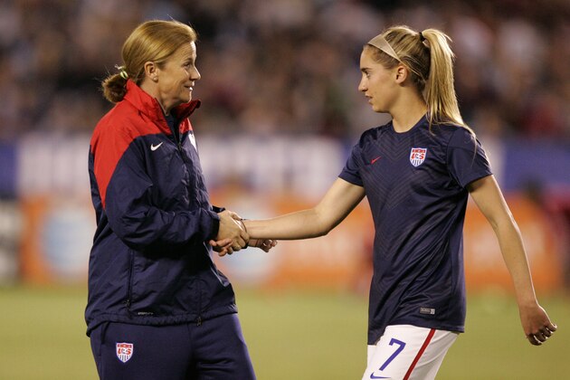 SAN DIEGO, CA - APRIL 10:  Interim head coach Jill Ellis of the United States shakes hands with Morgan Brian #7 prior to the first half of the game against China during an international firendly match at Qualcomm Stadium on April 10, 2014 in San Diego, California. (Photo by Kent C. Horner/Getty Images)