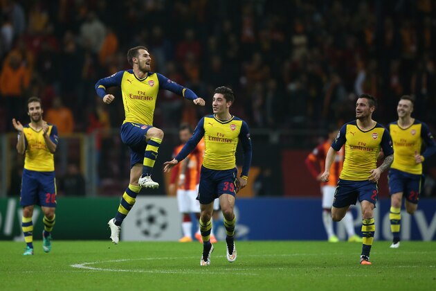 Arsenal's Aaron Ramsey celebrates with team mates after he scored during their Champions League Group D soccer match with Galatasaray at the Turk Telekom Arena Stadium in Istanbul, Turkey, Tuesday, Dec. 9, 2014. (AP Photo/Emrah Gurel)