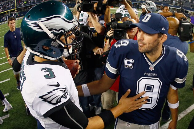 ARLINGTON, TX - NOVEMBER 27: Quarterback Tony Romo #9 of the Dallas Cowboys talks with quarterback Mark Sanchez #3 of the Philadelphia Eagles after the Eagles beat the Cowboys 33-10 at AT&T Stadium on November 27, 2014 in Arlington, Texas.  (Photo by Tom Pennington/Getty Images)