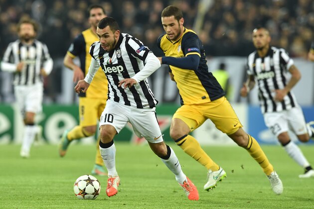TURIN, ITALY - DECEMBER 09:  Carlos Tevez of Juventus in action during the UEFA Champions League group A match between Juventus and Club Atletico de Madrid at Juventus Arena on December 9, 2014 in Turin, Italy.  (Photo by Valerio Pennicino/Getty Images)