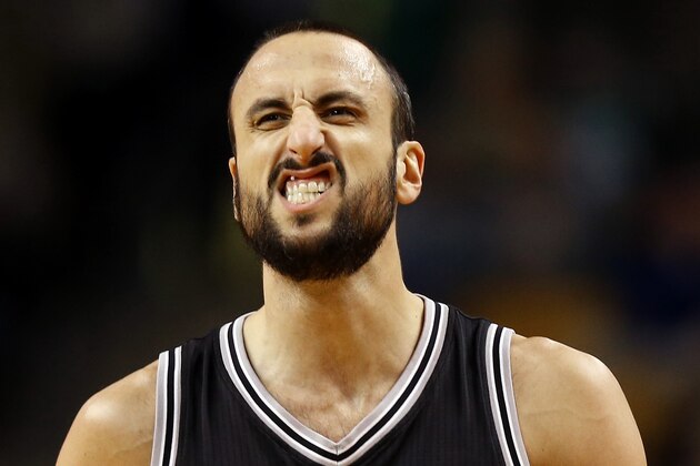 San Antonio Spurs' Manu Ginobili reacts against the Boston Celtics during the second half of an NBA basketball game in Boston Sunday, Nov. 30, 2014. (AP Photo/Winslow Townson)