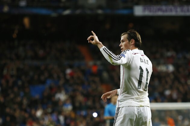 Real Madrid’s Gareth Bale celebrates after scoring the team's second goal during a Group B Champions League soccer match between Real Madrid and Ludogorets at the Santiago Bernabeu stadium in Madrid, Spain, Tuesday, Dec. 9, 2014. (AP Photo/Andres Kudacki)