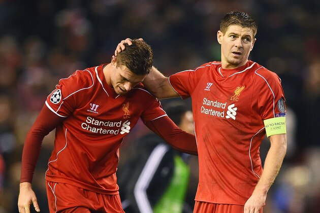 LIVERPOOL, ENGLAND - DECEMBER 09:  (L-R) Dejected Liverpool players Jordan Henderson and Steven Gerrard react following their team's 1-1 draw during the UEFA Champions League group B match between Liverpool and FC Basel 1893 at Anfield on December 9, 2014 in Liverpool, United Kingdom.  (Photo by Laurence Griffiths/Getty Images)