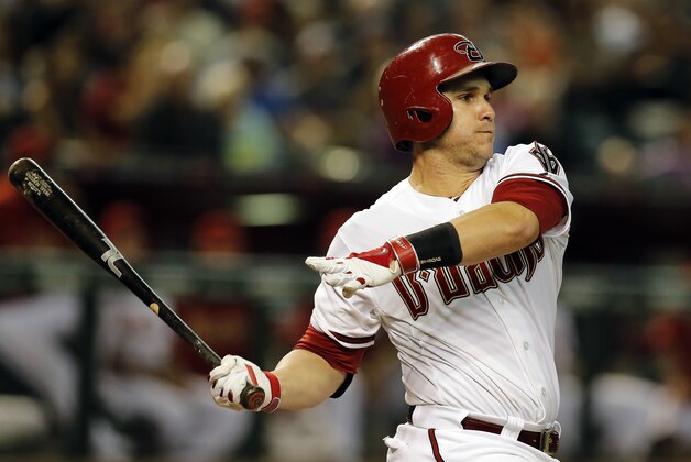 Sep 26, 2014; Phoenix, AZ, USA; Arizona Diamondbacks catcher Miguel Montero (26) singles against the St. Louis Cardinals in the first inning at Chase Field. Mandatory Credit: Rick Scuteri-USA TODAY Sports
